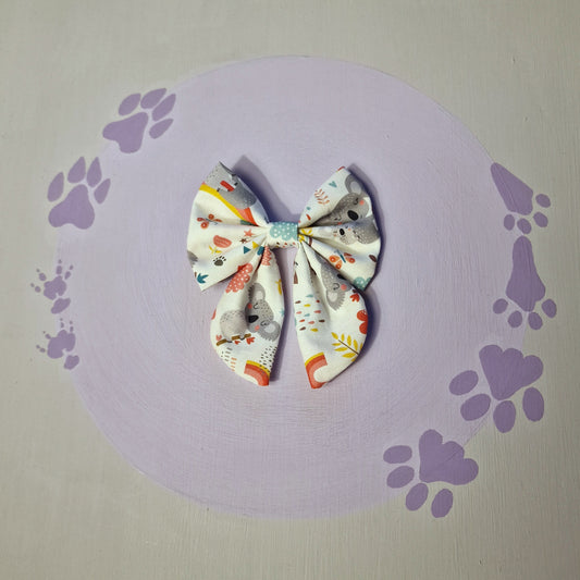 Sleepy koalas sailor bows